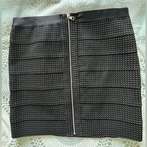 Never worn Knee length black skirt with sparkly threading